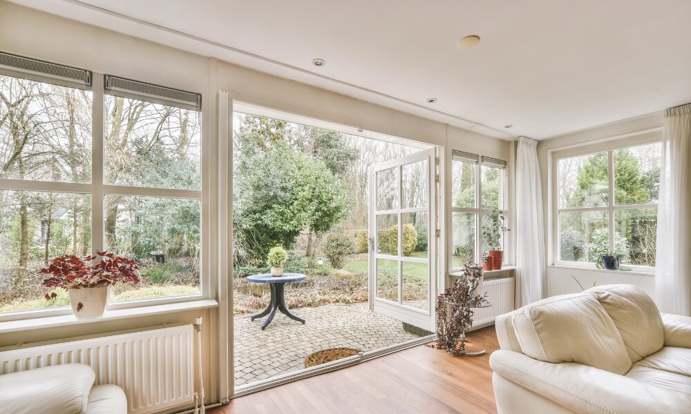 an airy four seasons room with large double hung windows